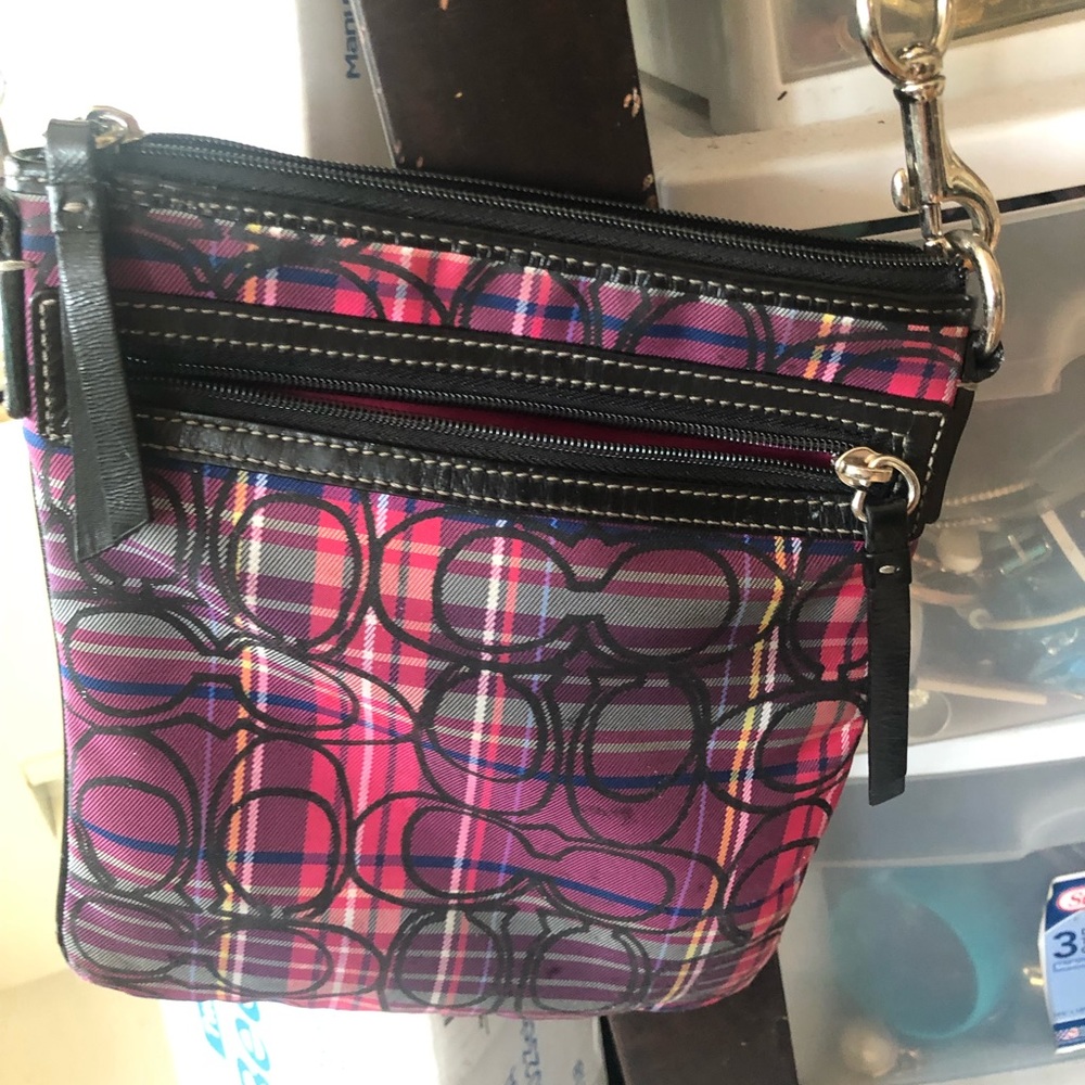Coach purse small in size.